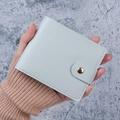 Minimalist light blue leather card holder with gold snap button and stitched details - Blue