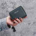 Women's dark green short zip wallet in pebble leather with tassel and leaf charm detail - Green