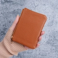 Compact caramel brown pebbled leather wallet with gold zipper and minimalist design - Brown