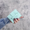 Short mint green leather trifold wallet for women with stylish strap closure - Green