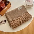 Brown cashmere feel scarf with fringe and brand label on white gift setting - Heathered Camel