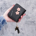 Short black PU leather wallet for women with pink flower applique and tassel charm - Black