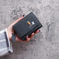 Black tri-fold wallet featuring a cute carrot and rabbit design with a fishbone charm - Black