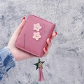 Short PU leather wallet for women in dusty rose pink with floral appliques and tassels - Deep Pink