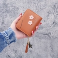Short orange-brown faux leather wallet featuring floral embroidery and star tassel charm - Brown