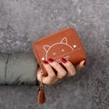 Short brown caramel zip wallet for women featuring a cute cat print and tassel detail - Brown
