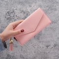Pink lychee grain long envelope wallet for women with golden heart charm and tassel - Pink