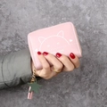 Pink short PU leather wallet featuring a cute cat print and a green star charm - Pink