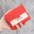 Short bi-fold wallet in red and beige faux leather with a golden square metal buckle - Red