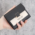 Women's compact short wallet in black and white leather with gold buckle detail - Black