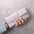 Detail of lavender PU leather long wallet with litchi texture and buckle closure - Purple