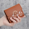 Brown short wallet for women featuring white cherry blossom print and gold floral buckle - Brown