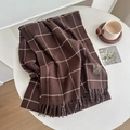 Dark brown plaid scarf with white grid lines and fringe details on a white table - Large Plaid Coffee