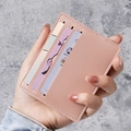 Slim pink litchi pattern leather card holder with three card slots held by a hand - Pink