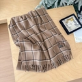 Brown plaid faux cashmere scarf with vintage patch and tassels on a wood surface - Double Line Large Plaid Khaki