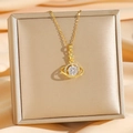 Collier planète doré avec zircone étincelante et pendentif étoile sur soie - Planète Dorée (8675)