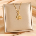 Micro-pave gold Christmas tree necklace with snowflake pendant on a jewelry gift box - Gold Rotating Christmas Tree (8399)