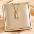 Elegant gold titanium necklace featuring a rectangular zircon pendant with diamond accents - Gold White Zircon (8130)