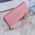 Elegant pink long wallet for women featuring soft lychee texture and wrist strap - Deep Pink