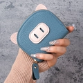 Dark blue leather piggy card wallet with zipper and cute 3D ears detail in hand - Blue