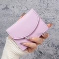 Minimalist lavender PU leather card holder featuring a curved flap and fine texture - Purple