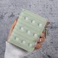 Short mint green women's wallet featuring daisy embroidery and quilted PU leather - Green