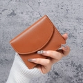 Minimalist caramel brown PU leather card holder with textured foldover flap design - Brown