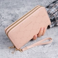 Pink lychee leather long wallet for women featuring double zippers and a wrist strap - Pink