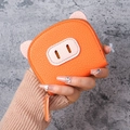 Cute orange pig-shaped accordion card holder in pebble leather with a gold zipper - Orange