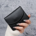 Minimalist black PU leather wallet with lychee pattern held by hand showing compact size - Black