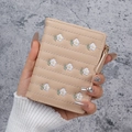 Short beige wallet for women with daisy embroidery and gold zipper closure - Apricot