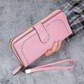 Pink oil wax PU leather long wallet for women featuring heart-shaped cutout and wrist strap - Pink