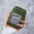 Dark green leather zipper card holder with multiple slots and ID window shown in hand - Dark Green