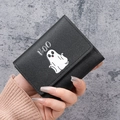 Short black trifold wallet featuring white ghost print and BOO text in faux leather - Black