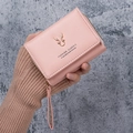 Pink PU leather bifold wallet featuring golden elk antlers and a side zipper strap - Light Pink