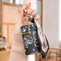Mini leather coin purse in black with cartoon bear pattern and gold lobster clasp - Black
