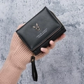 Short black PU leather wallet for women with golden reindeer logo and wrist strap - Black