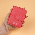 Red pebbled leather short wallet for women featuring golden zipper and magnetic closure - Red