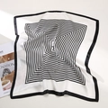 Close-up of a silk square scarf featuring black and white geometric spiral patterns - Black Stripe