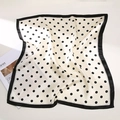 Close-up of elegant silk neck scarf with black polka dots on ivory and black border - Polka Dot White