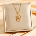 Luxurious titanium steel necklace with gold flower pendant and pink cubic zirconia - Pink Zirconia
