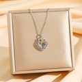 Detail of silver double heart necklace with multi-colored crystals on silk background - Silver Colorful Heart (8594)