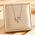 Elegante collana con fiocco e stella placcata oro 18 carati con brillanti zirconi cubici - Fiocco d'Argento
