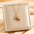 Elegante collar de acero de titanio dorado con colgante de doble cisne y piedra púrpura - Oro Circonita Violeta