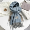 Detail of light blue and beige double-sided scarf with tassels and woven label - Gray Blue