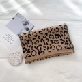 Brown and black leopard print knitted scarf with ribbed edges on a white background - Light Camel Leopard Print
