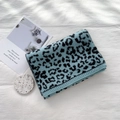 Thick knitted leopard print scarf in blue and black pattern with ribbed edges - Fluorescent Blue Leopard Print