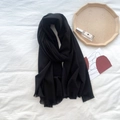 Classic black cashmere feel fringed scarf for women in a stylish lifestyle arrangement - Black