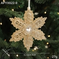 Champagne gold glitter snowflake ornament with center crystal on a Christmas tree - Five-pointed Star