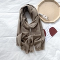Coffee brown solid cashmere feel scarf with soft fringes shown on minimalist background - Grey Green